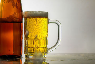 Close-up of beer glass on table