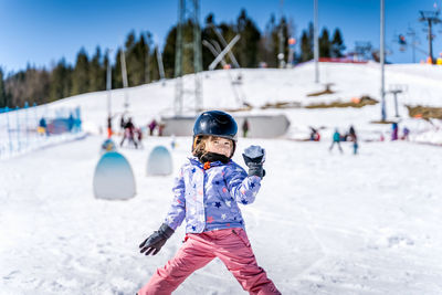 Full length of child on snowy field during winter