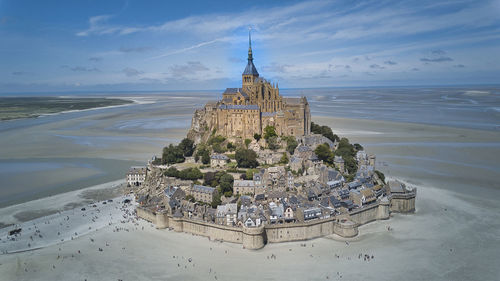 Panoramic view of sea and building against sky