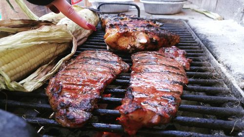 Close-up of meat on barbecue grill