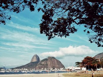 View of beach against cloudy sky