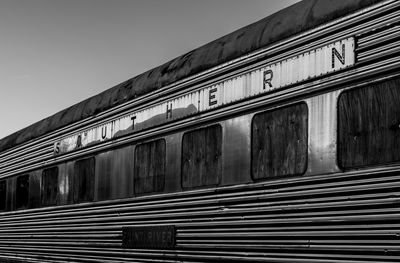 Text on metallic train outdoors