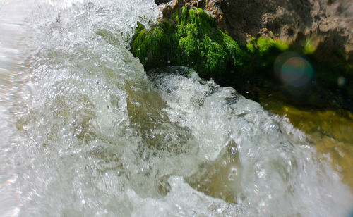 Close-up of water splashing in river