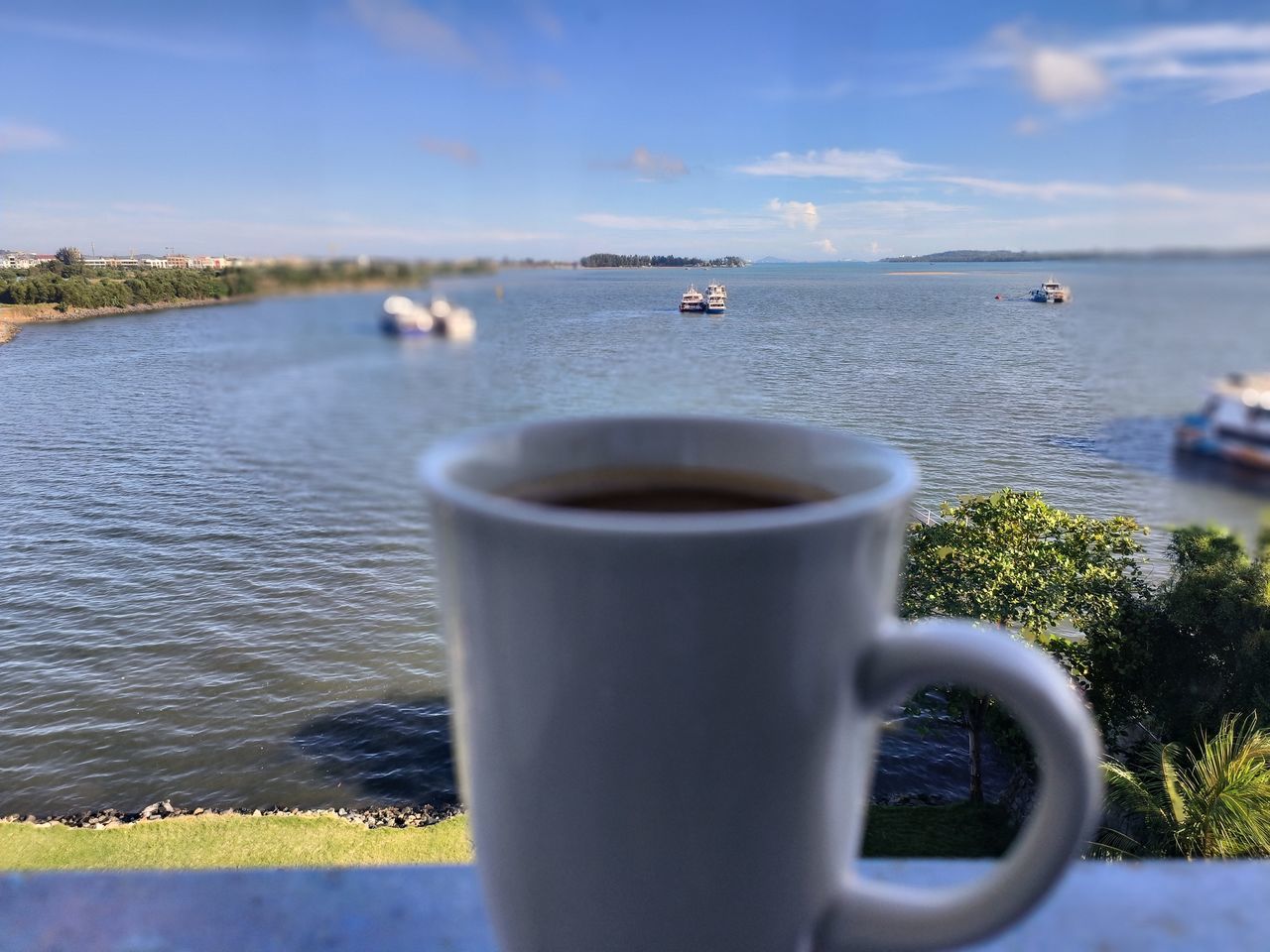 water, coffee cup, sky, drink, coffee, mug, cup, sea, nature, food and drink, beach, refreshment, morning, day, shore, cloud, blue, no people, transportation, outdoors, vacation, land, travel destinations, scenics - nature, coast, travel, nautical vessel, plant, beauty in nature, tranquility, ocean, hot drink