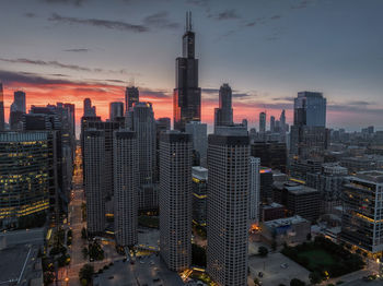 Aerial view of city lit up at night