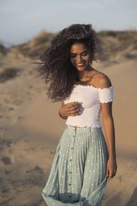 Young woman standing on beach