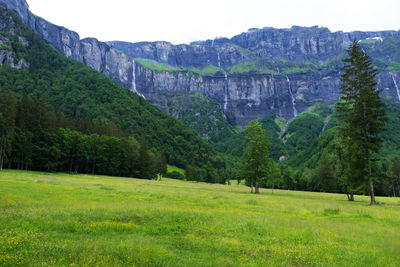 Scenic view of landscape and mountains against sky
