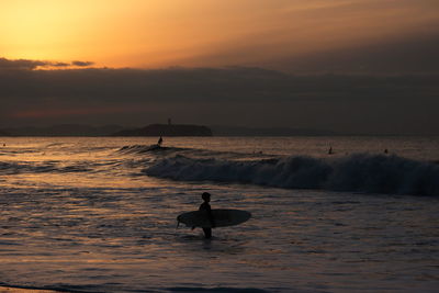 Scenic view of sea at sunset