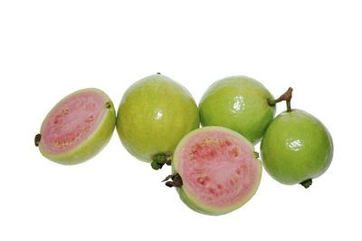 Close-up of apples in spring against white background