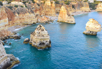 High angle view of rock formations in sea