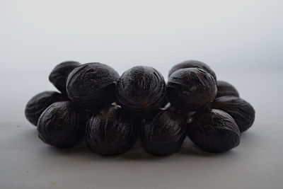 Close-up of blueberries against white background