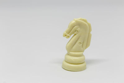 Close-up of figurine against white background