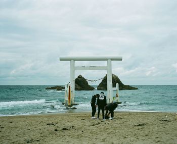 Woman perching on beach