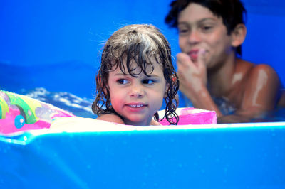 Girl looking away in wading pool