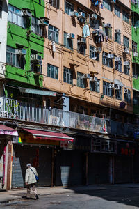 Rear view of woman walking on street