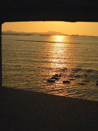 Scenic view of sea against sky at sunset