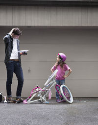 Low angle view of man riding bicycle