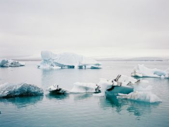 Scenic view of frozen sea against sky