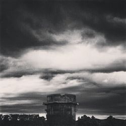 Low angle view of historic building against cloudy sky