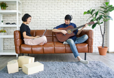 Young couple sitting on sofa