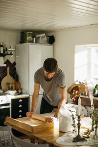 Man rolling dough