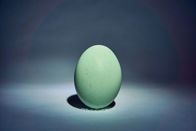 Close-up of green ball on table