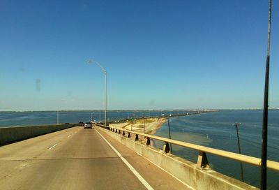 Empty road along sea
