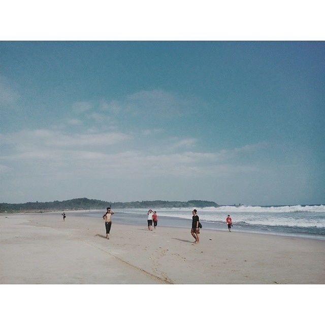 transfer print, sea, water, beach, auto post production filter, sky, leisure activity, lifestyles, men, large group of people, horizon over water, vacations, person, mixed age range, shore, nature, cloud - sky, day, sand