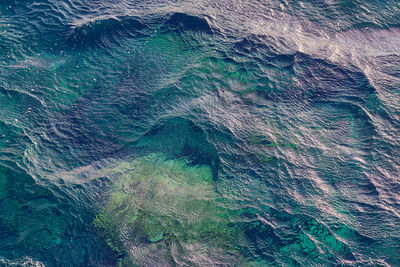 Waves on the surface of the turquoise tropical sea