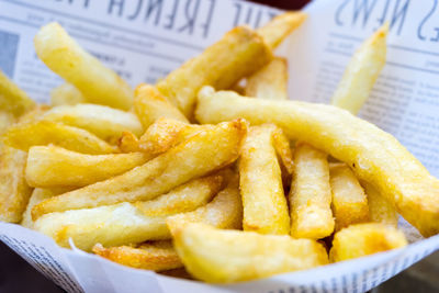 Close-up of fresh french fries in paper