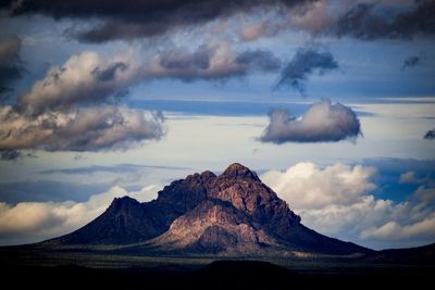 Mountains against cloudy sky