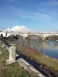 Bridge over river against sky