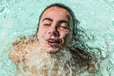 Close-up of woman swimming in pool