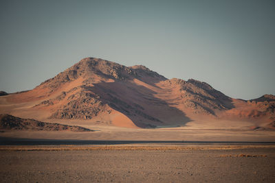 Scenic view of snowcapped mountains against clear sky