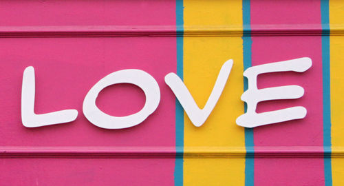 Close-up of multi colored text on wall