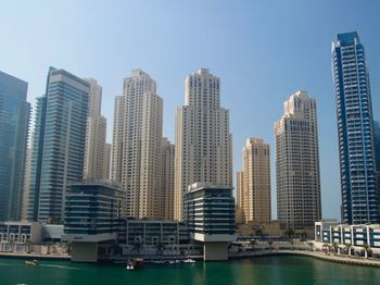 Modern buildings in city against sky