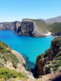 Scenic view of blue sea against clear sky