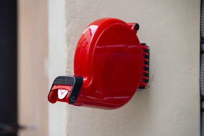 Close-up of red light mounted on wall
