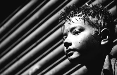 Close-up portrait of boy looking away