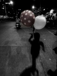 Man playing with ball at night