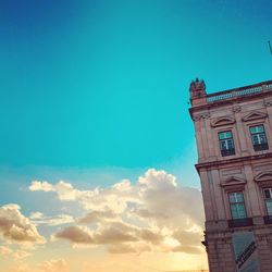 Low angle view of building against blue sky