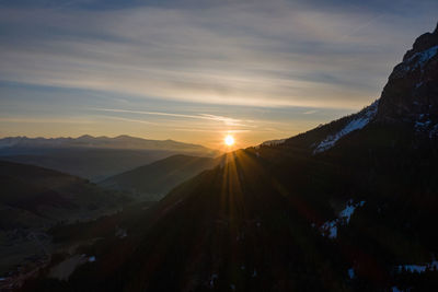 Scenic view of mountains against sky during sunset