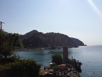 Scenic view of bay against clear sky