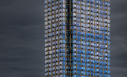 Low angle view of skyscraper against sky