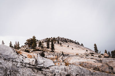 Low angle view of snow on mountain against sky