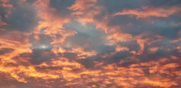 Low angle view of dramatic sky during sunset