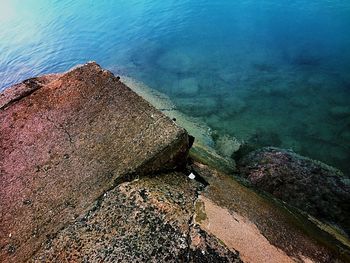 High angle view of rocks by sea