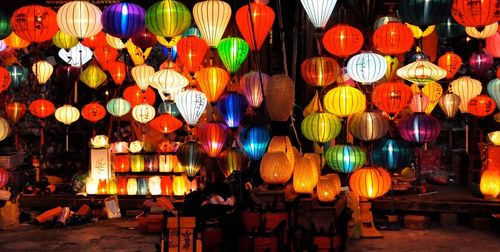 Illuminated lanterns displayed in shop