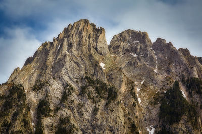 Low angle view of rock formation against sky