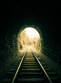 Railroad tracks in tunnel